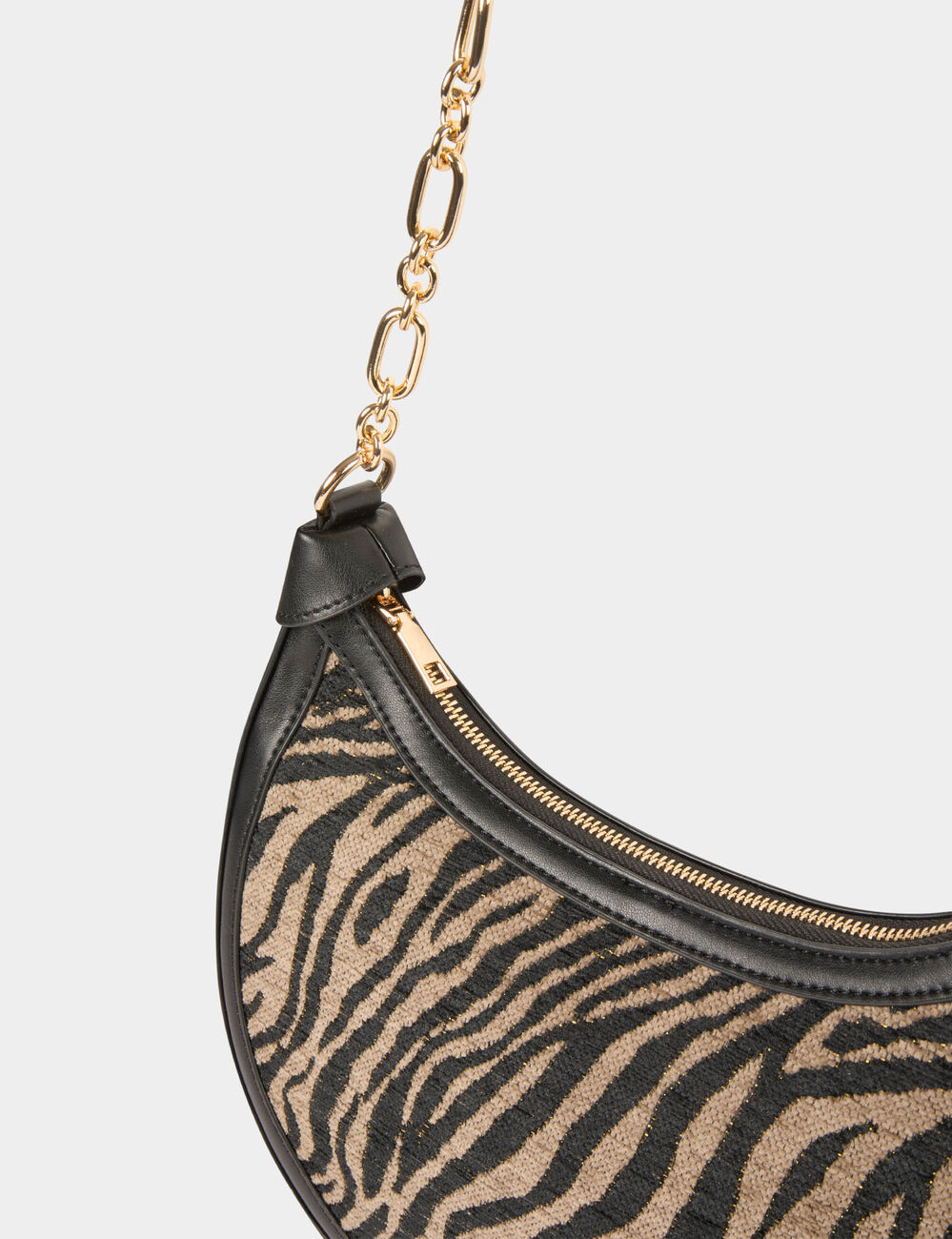 Bolso media luna de cebra negro mujer