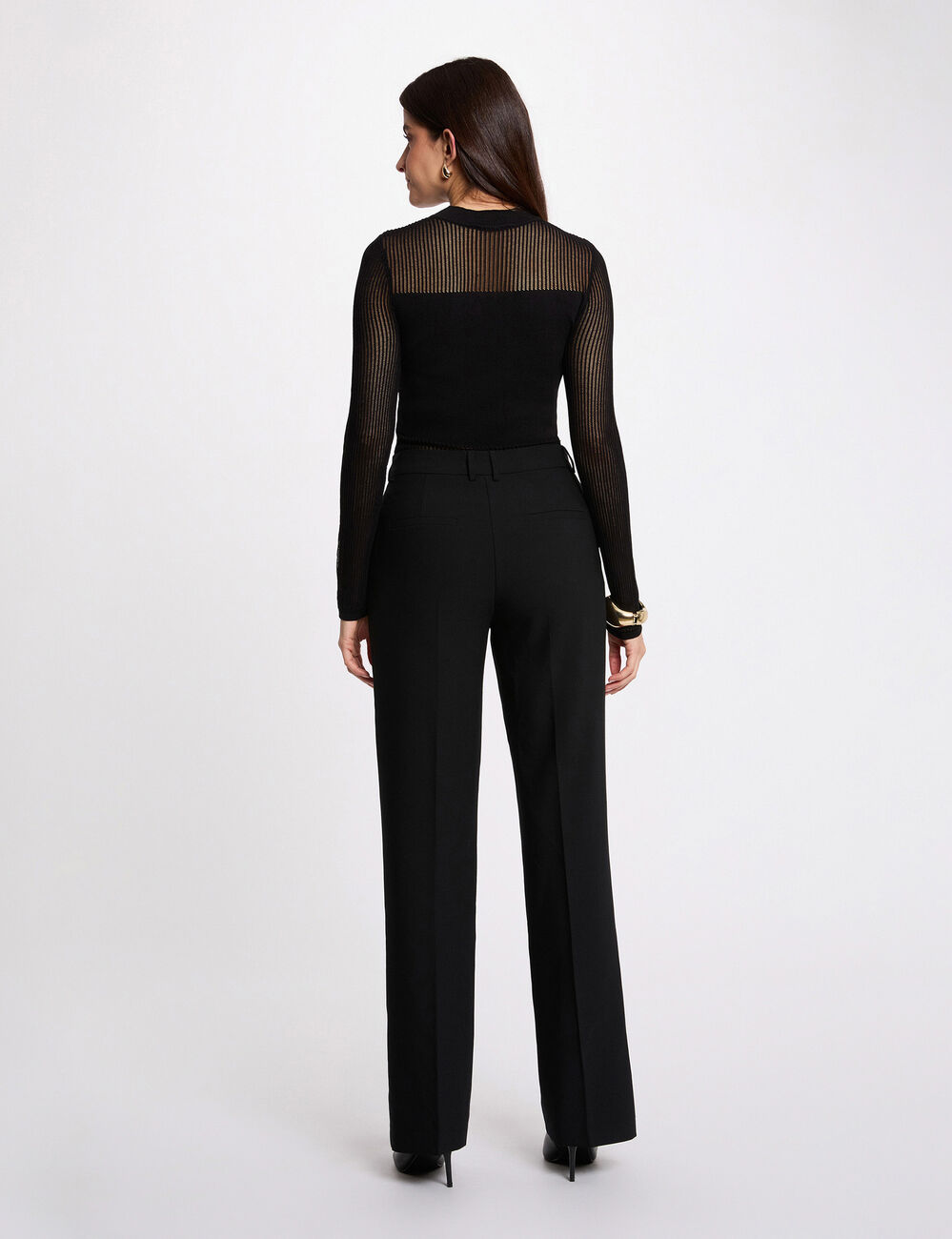 Jersey calado de cuello alto negro mujer