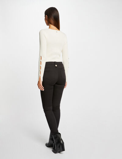 Pantalón skinny con botones decorativos negro mujer