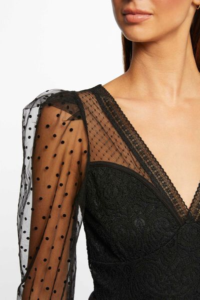 Body manga larga con plumeti negro mujer
